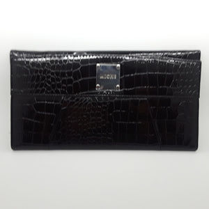 Miche Black faux leather cover.